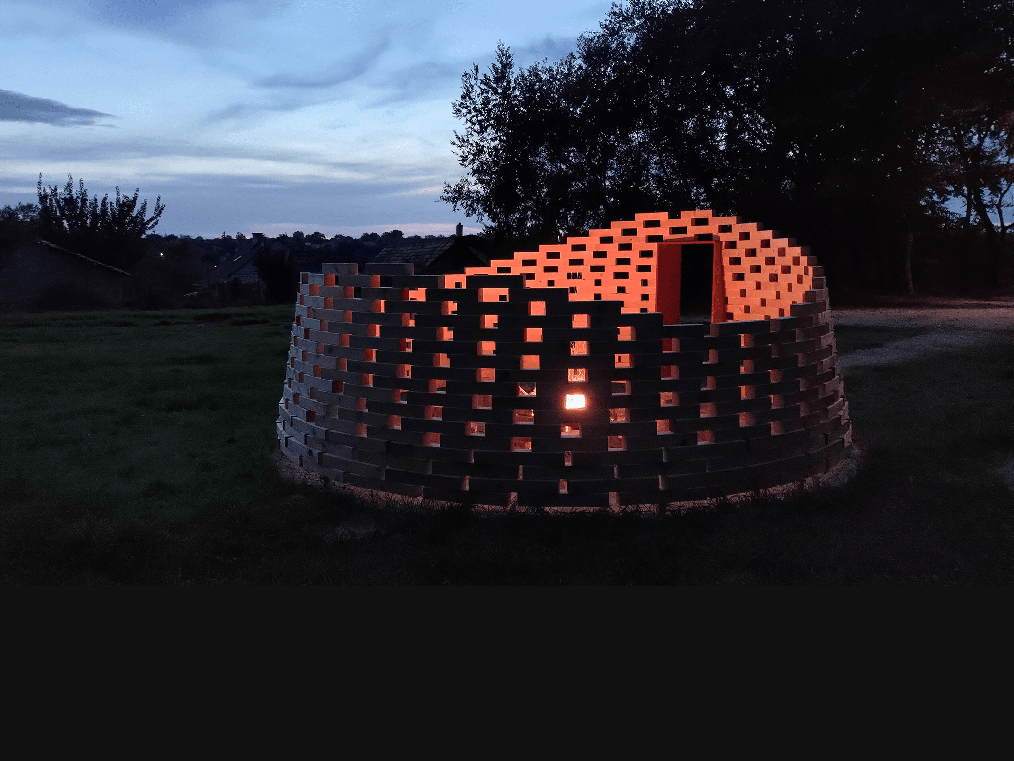 Completed fire pit installation at night